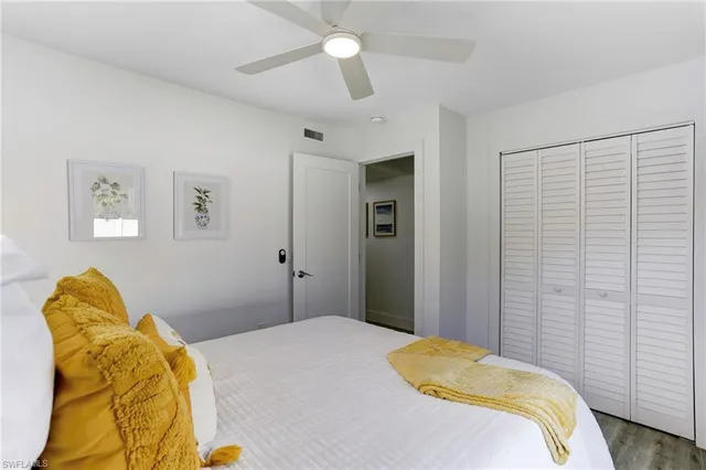 a bedroom with a bed and a couch