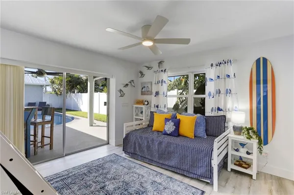 a living room with furniture and wooden floor