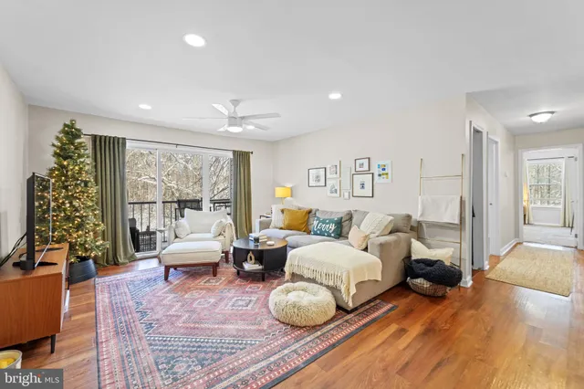 a bedroom with two beds and a large window