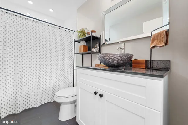 a bathroom with a toilet and a sink
