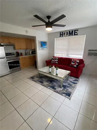 a kitchen with granite countertop a stove and a refrigerator