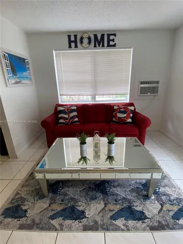 a room with a stove and a rug