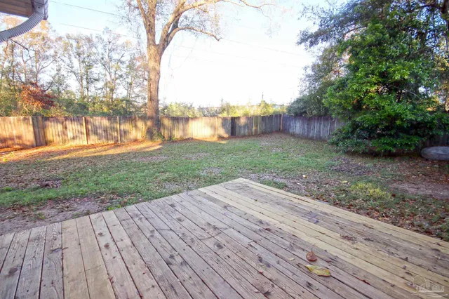 a view of a backyard of the house