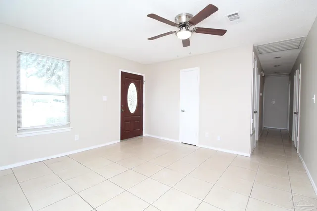 a view of an empty room with a window