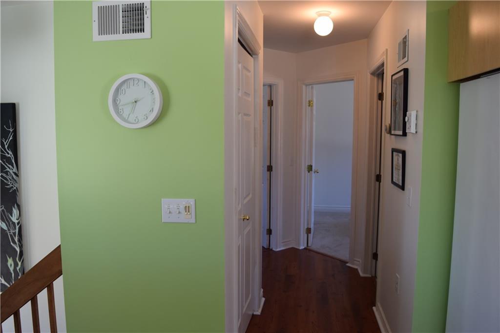 Hallway leading to two first floor...