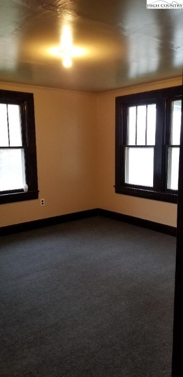 456 Grady Winkler Road Boone, NC 28607 - Photo 11 of 18 an empty room with wooden floor and windows