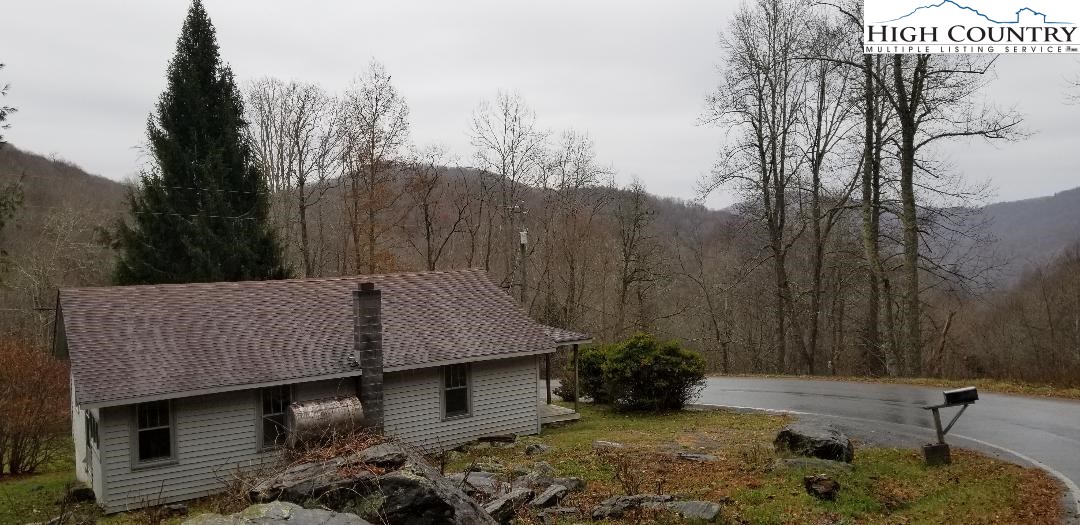 456 Grady Winkler Road Boone, NC 28607 - Photo 18 of 18 a backyard of a house with lots of green space