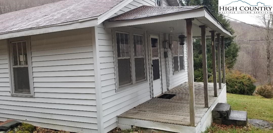 456 Grady Winkler Road Boone, NC 28607 - Photo 2 of 18 a view of a porch with a door and a porch