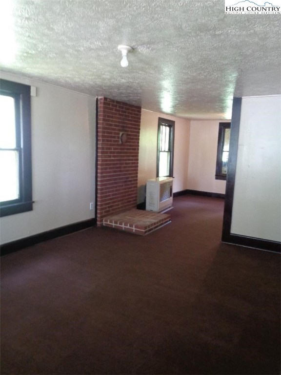 456 Grady Winkler Road Boone, NC 28607 - Photo 4 of 18 an empty room with windows