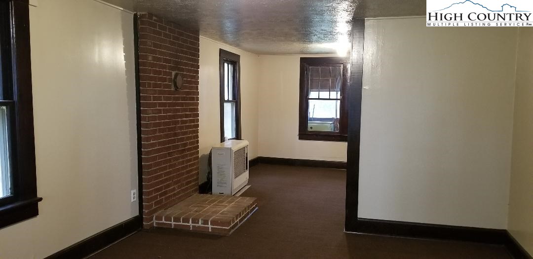 456 Grady Winkler Road Boone, NC 28607 - Photo 5 of 18 a view of an empty room with windows