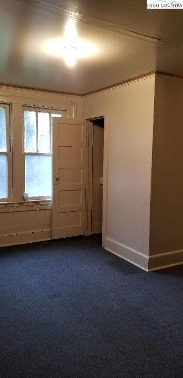 456 Grady Winkler Road Boone, NC 28607 - Photo 8 of 18 an empty room with a wooden door