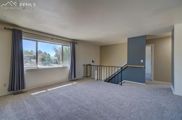 3870 Half Turn Road Colorado Springs, CO 80917 - Photo 16 of 34 Carpeted empty room featuring baseboards