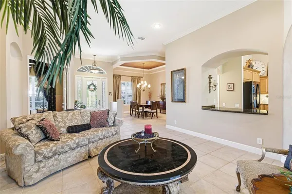 a spacious bedroom with a bed and a flat screen tv