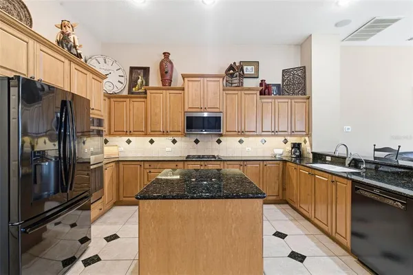 a spacious bathroom with a granite countertop tub sink and mirror