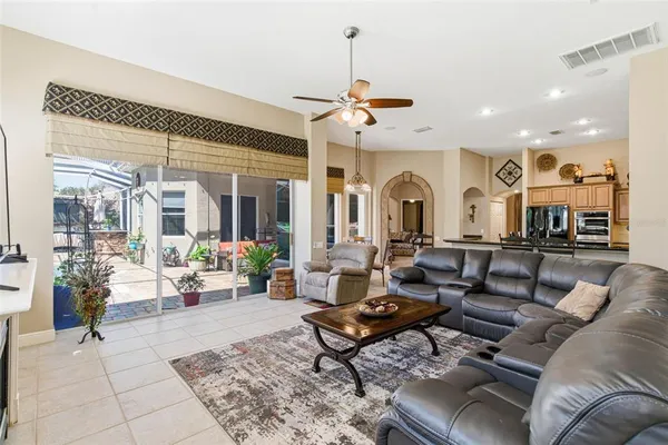 a bedroom with a bed dresser and a dining table