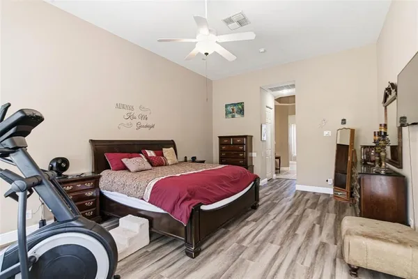 a bedroom with a bed and a dresser