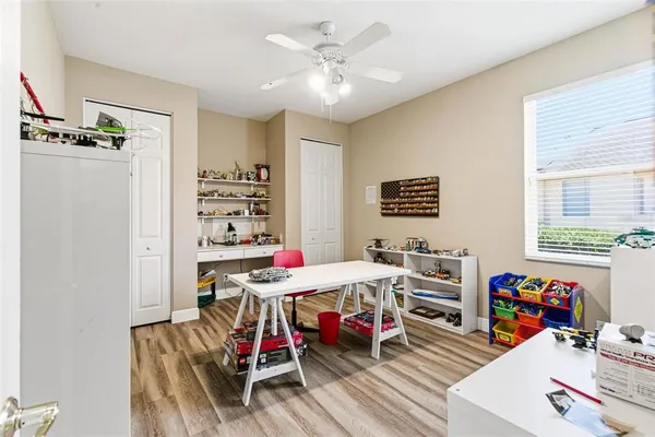a view of a house with swimming pool and sitting area