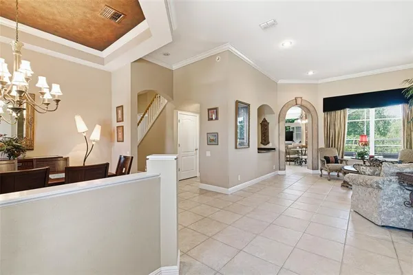 a view of hall way with furniture and window