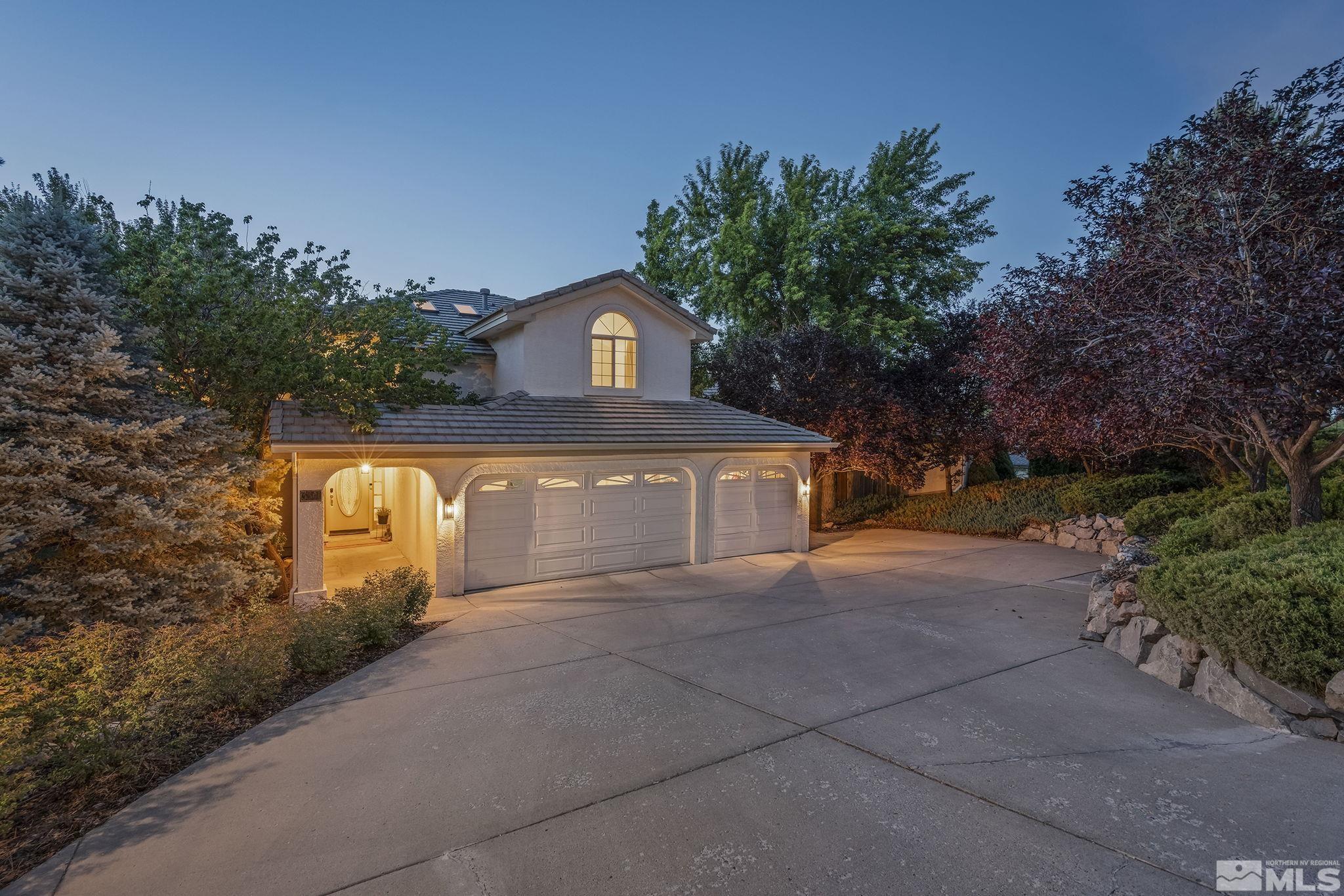 3341 Corey Drive Reno, NV 89509 - Photo 2 of 40 a front view of a house with a yard and garage