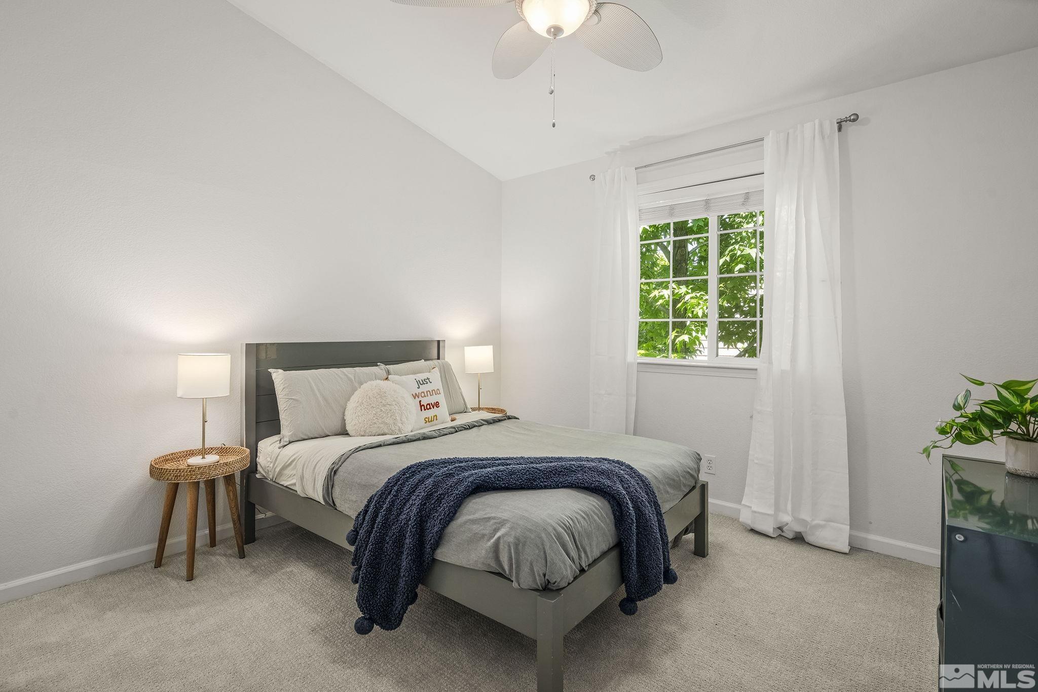 3341 Corey Drive Reno, NV 89509 - Photo 22 of 40 a bedroom with a bed and a potted plant
