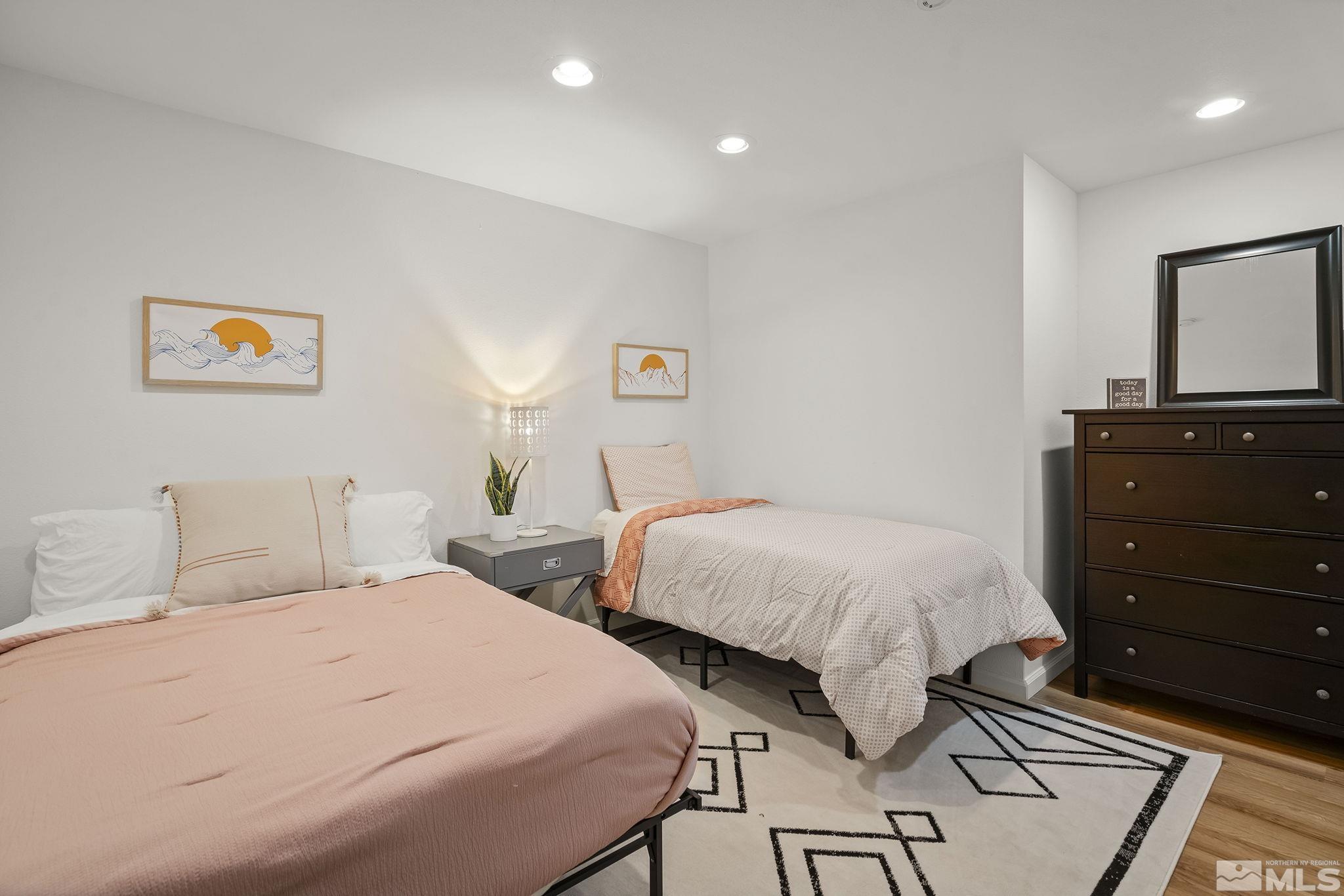 3341 Corey Drive Reno, NV 89509 - Photo 30 of 40 a bedroom with a bed and painting on the wall