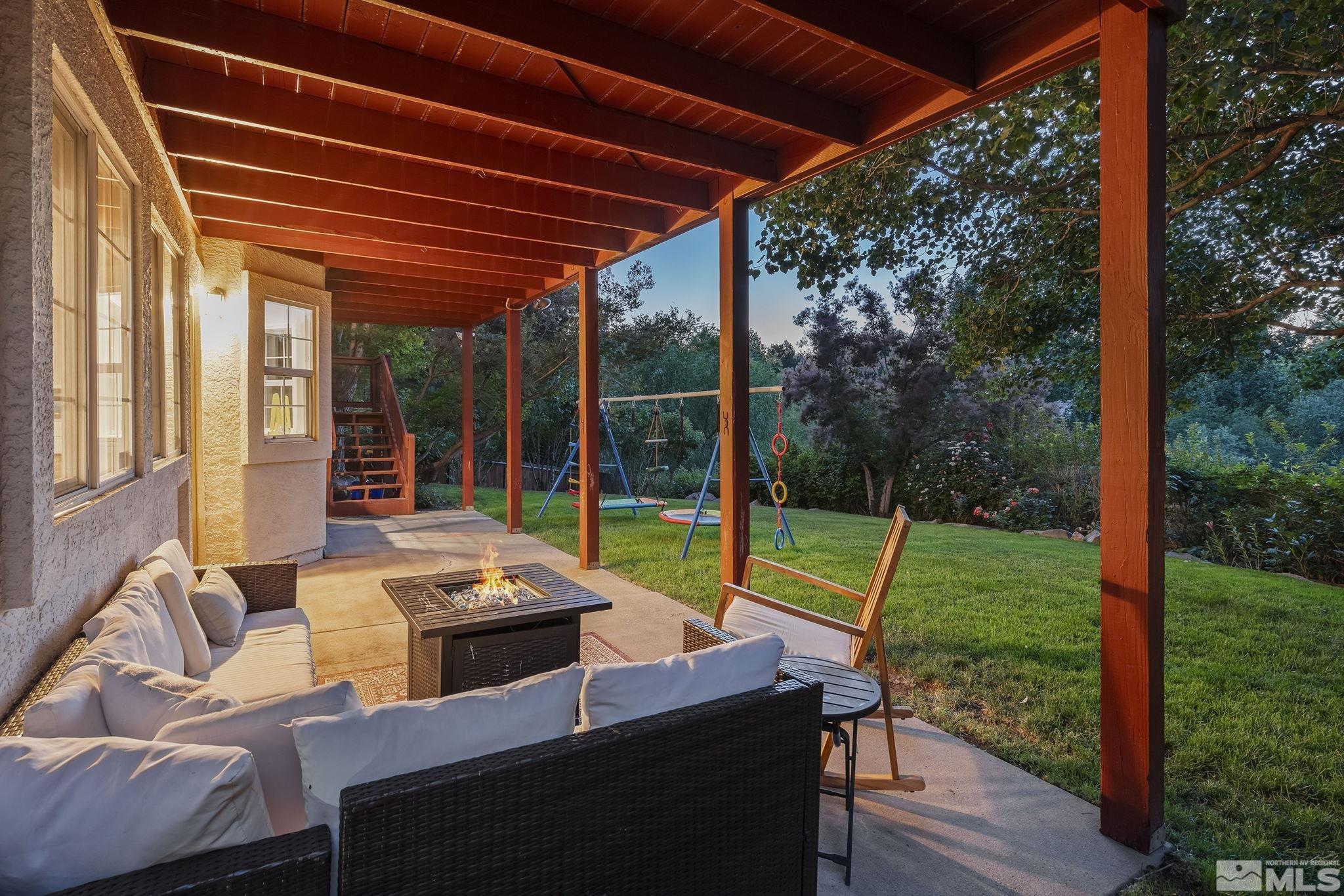 3341 Corey Drive Reno, NV 89509 - Photo 34 of 40 a view of a patio with a table chairs and a backyard