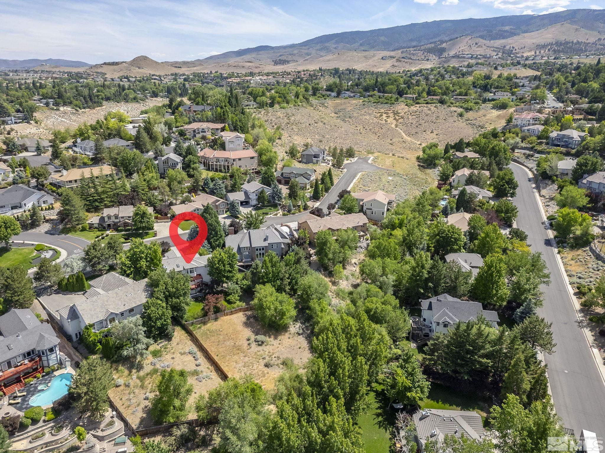 3341 Corey Drive Reno, NV 89509 - Photo 38 of 40 an aerial view of a city and mountain view in back