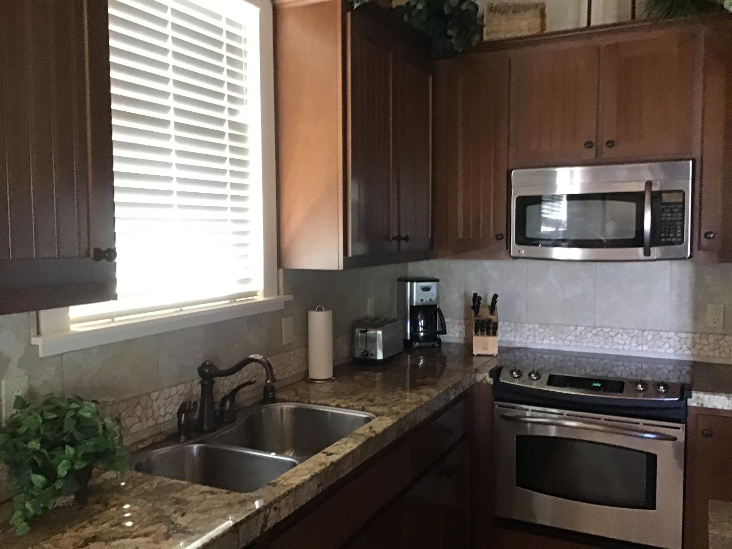 360 Town Square Road Copperopolis, CA 95228 - Photo 10 of 22 a kitchen with a sink stove and microwave