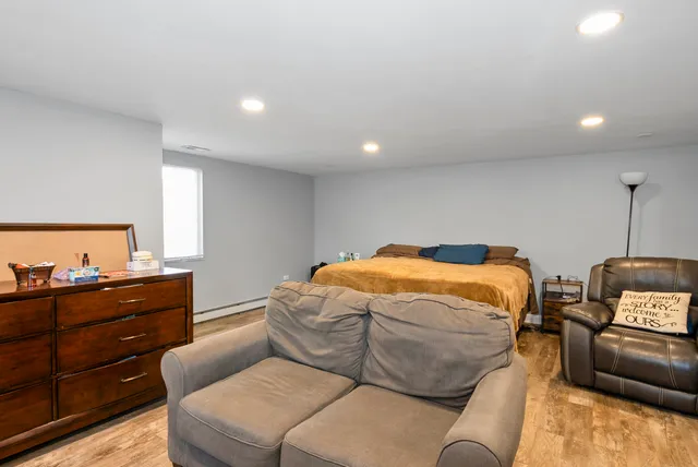 a bedroom with a bed and furniture