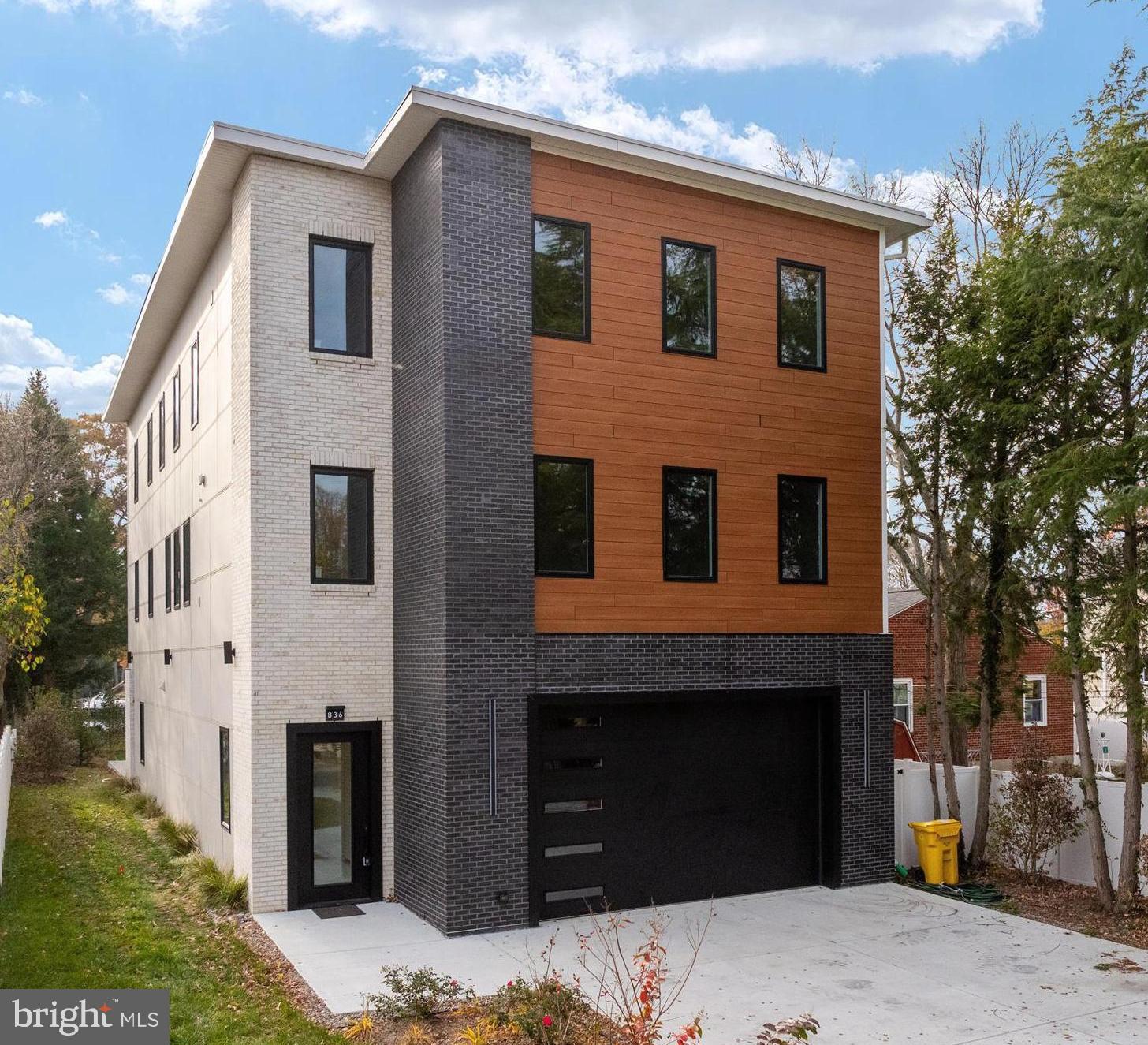 a front view of a house with yard
