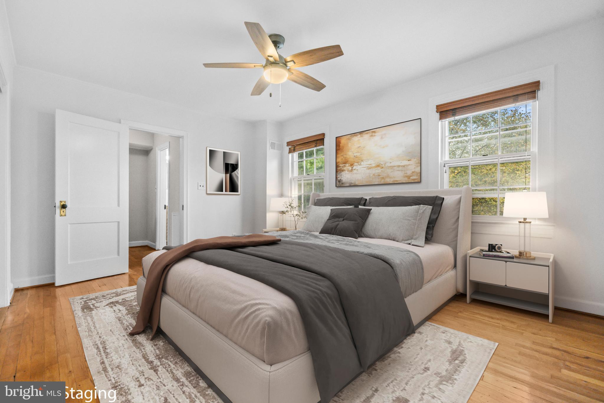 1400 South Edgewood Street, Unit 527 Arlington, VA 22204 - Photo 14 of 32 a bedroom with a large bed and a ceiling fan