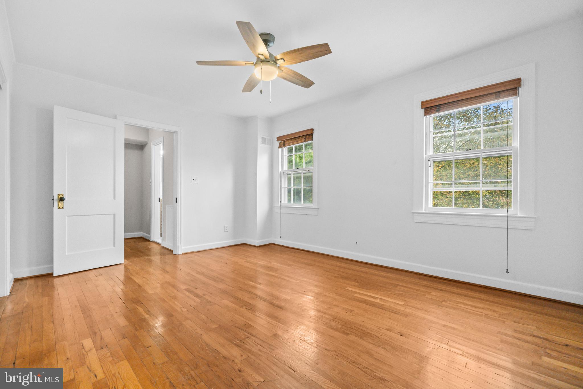 1400 South Edgewood Street, Unit 527 Arlington, VA 22204 - Photo 15 of 32 wooden floor in an empty room with a window