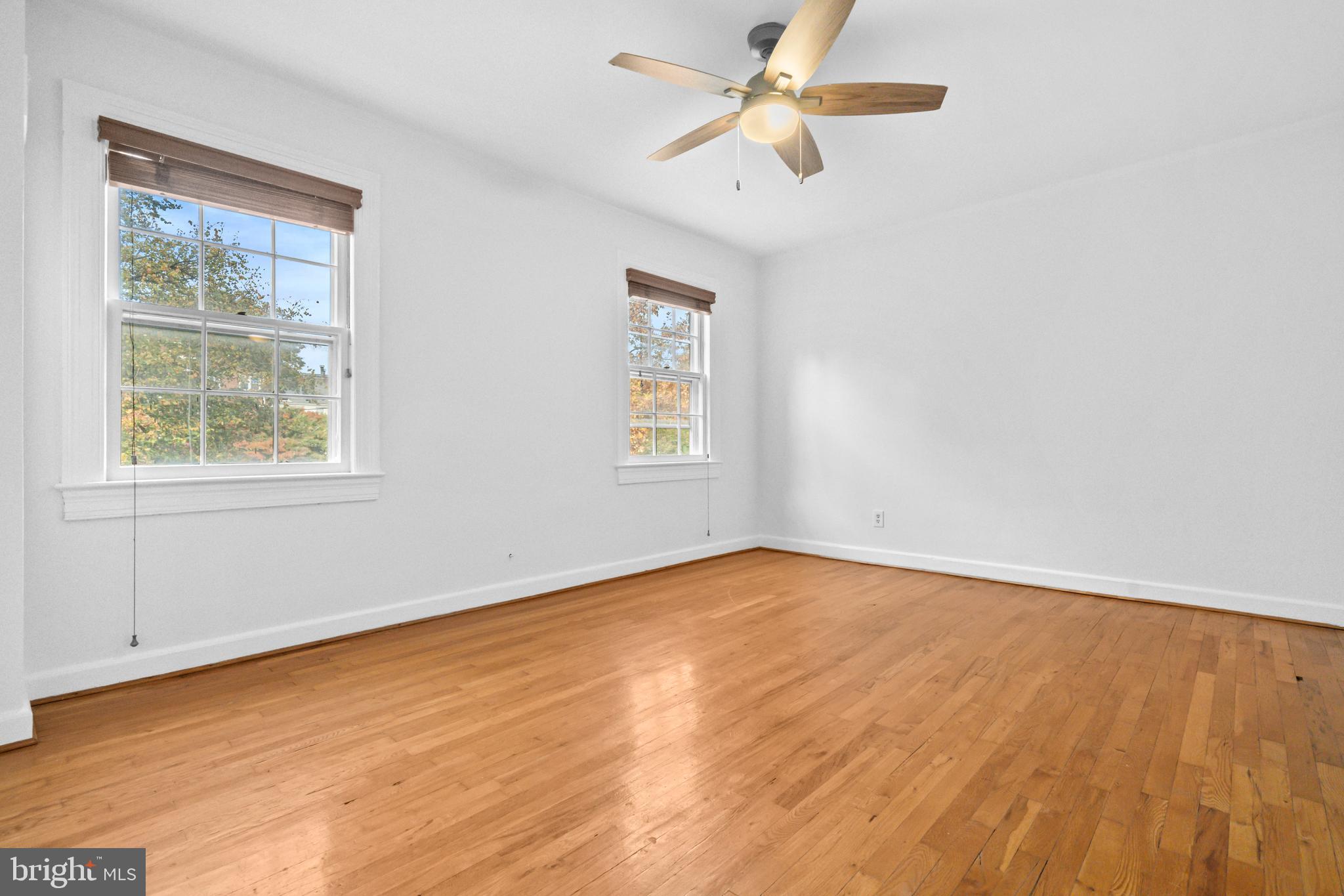 1400 South Edgewood Street, Unit 527 Arlington, VA 22204 - Photo 16 of 32 wooden floor in an empty room with a window