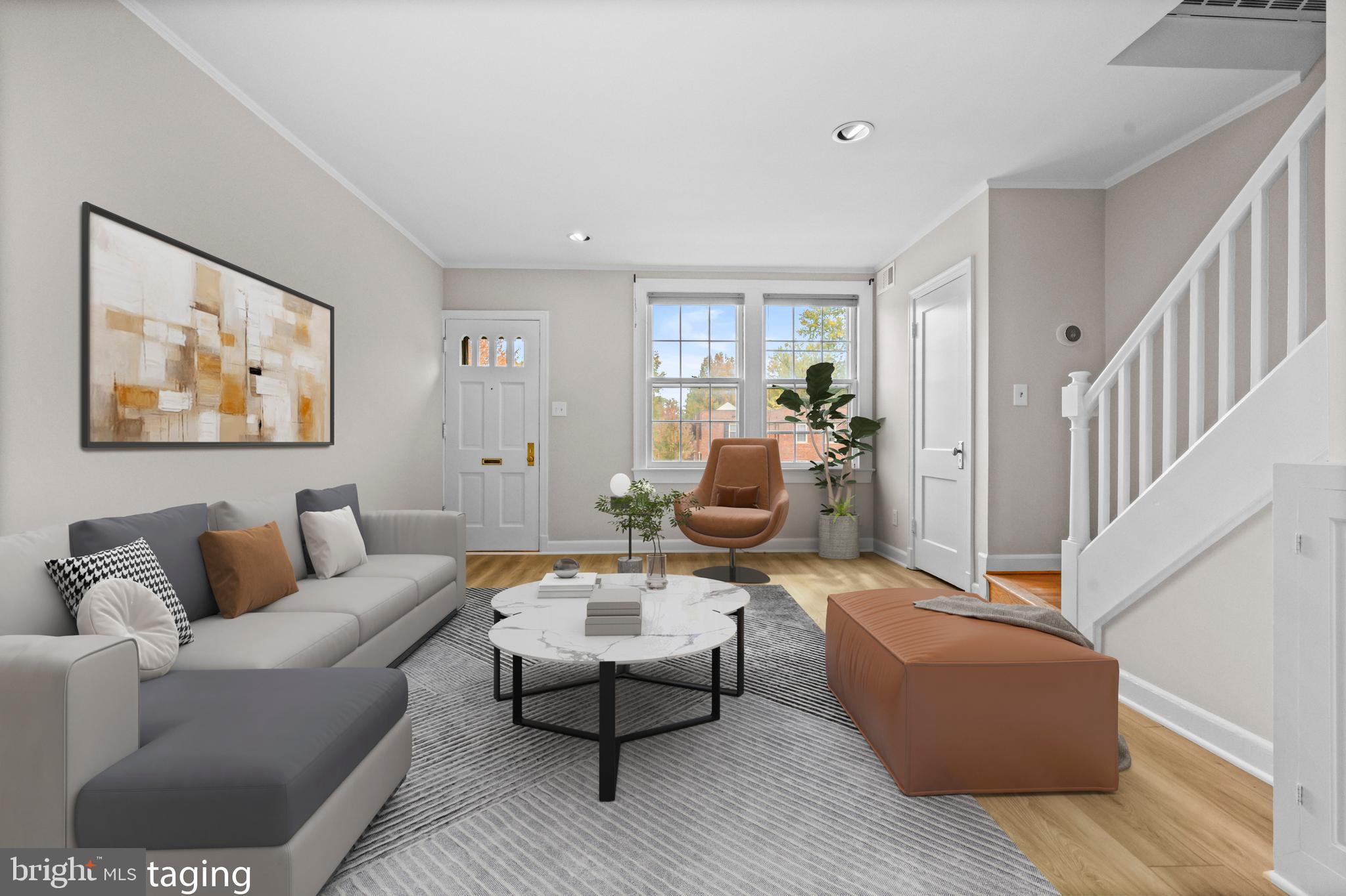 1400 South Edgewood Street, Unit 527 Arlington, VA 22204 - Photo 2 of 32 a living room with furniture and wooden floor