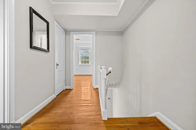 a view of a room with wooden floor and closet