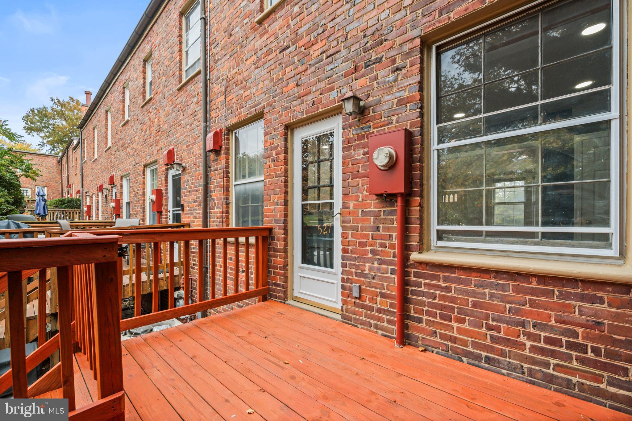 1400 South Edgewood Street, Unit 527 Arlington, VA 22204 - Photo 29 of 32 a view of a brick house with large windows