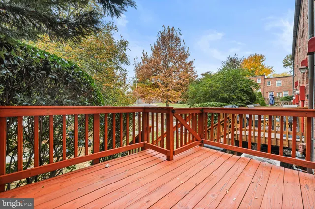 a balcony with wooden floor