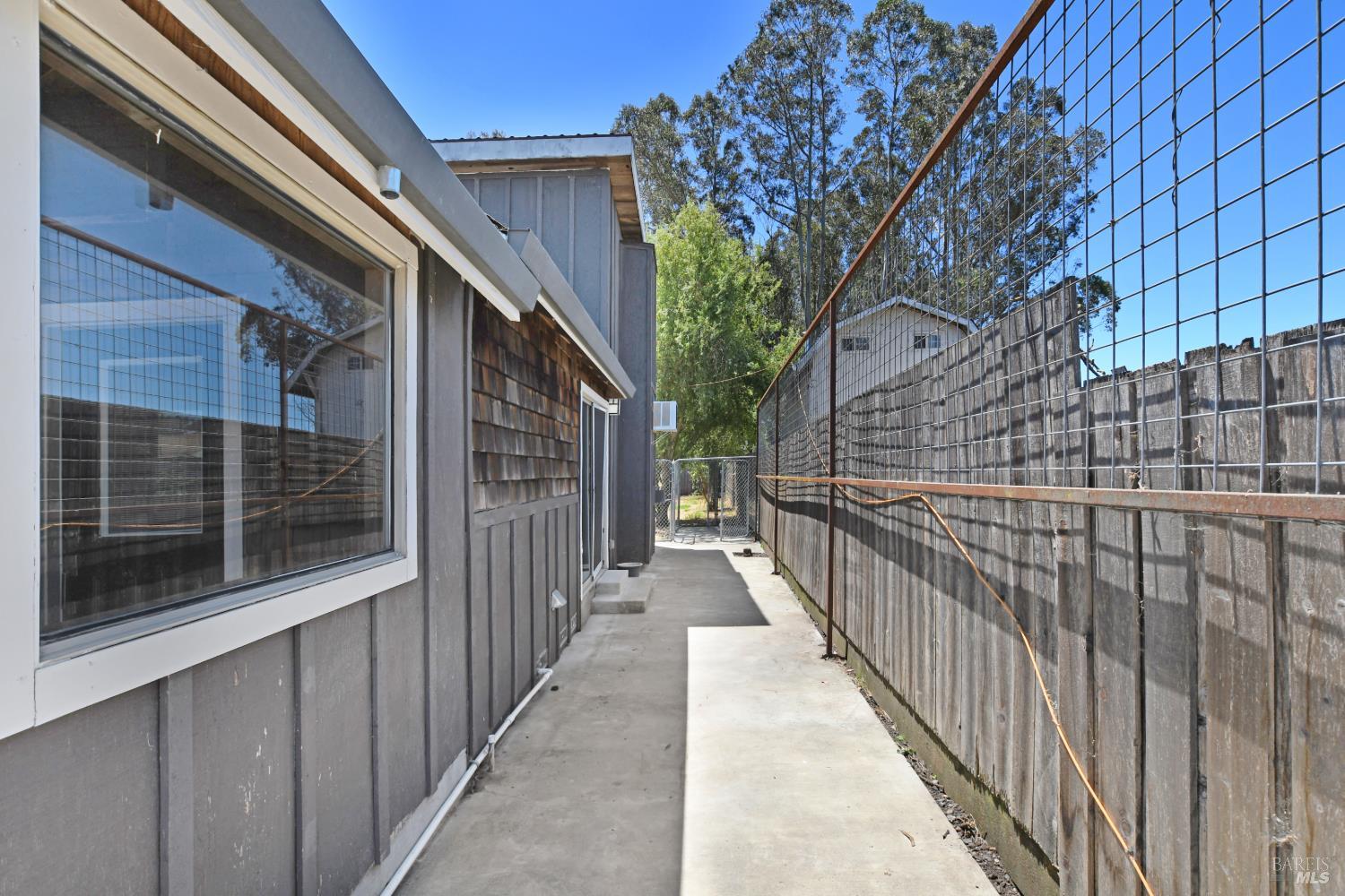 866 Yuba Drive Santa Rosa, CA 95407 - Photo 47 of 73 ADU PATIO W/ DOG RUN AT BACK