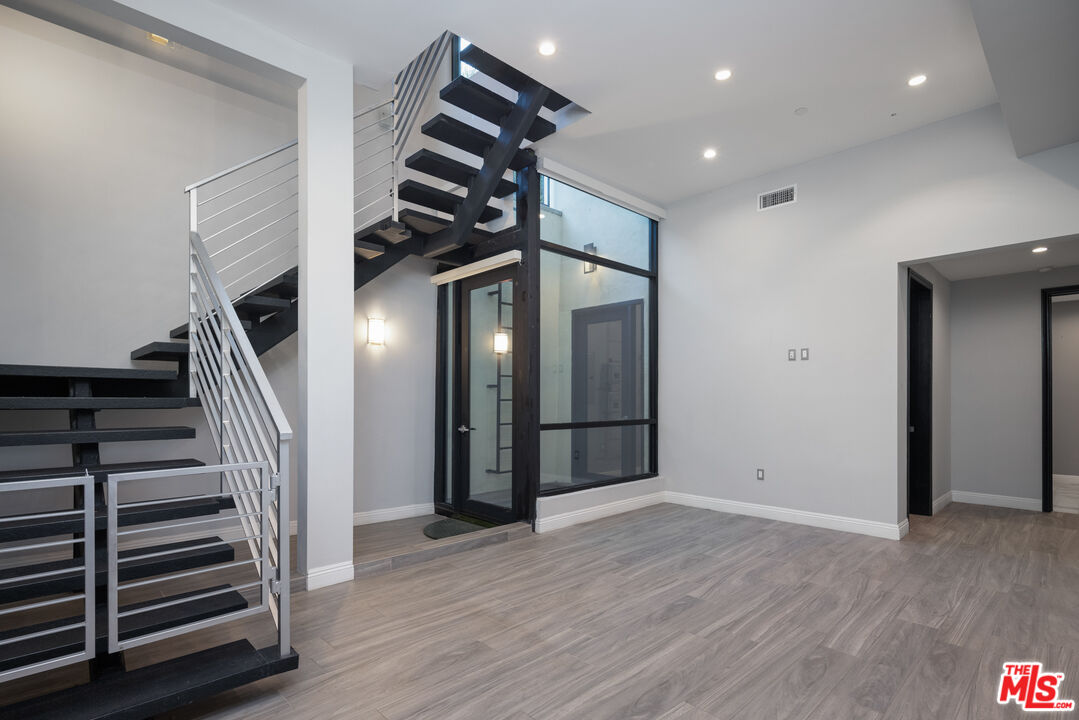 156 North Wetherly Drive Beverly Hills, CA 90211 - Photo 21 of 57 a view of entryway with wooden floor