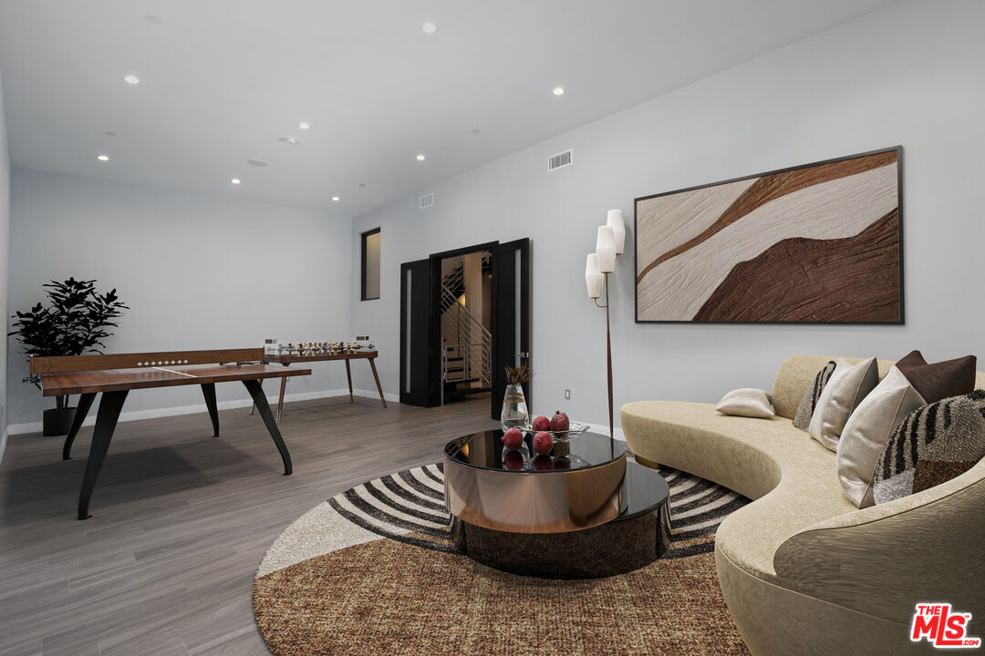 156 North Wetherly Drive Beverly Hills, CA 90211 - Photo 26 of 57 a living room with furniture and a potted plant