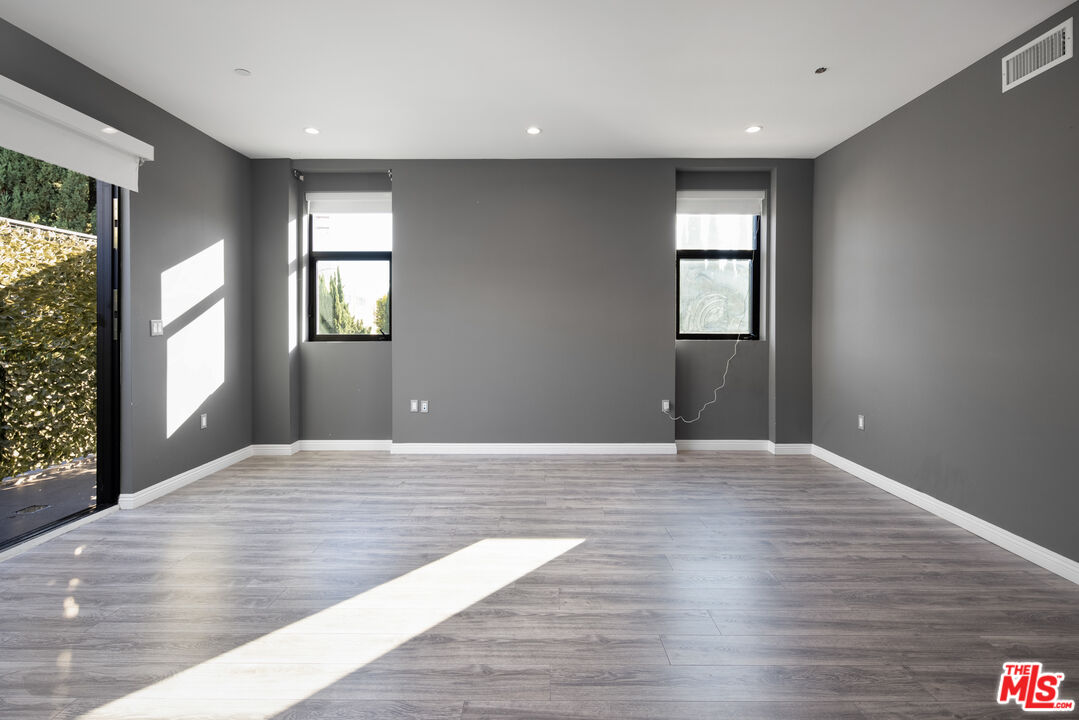 156 North Wetherly Drive Beverly Hills, CA 90211 - Photo 38 of 57 wooden floor in an empty room with a window