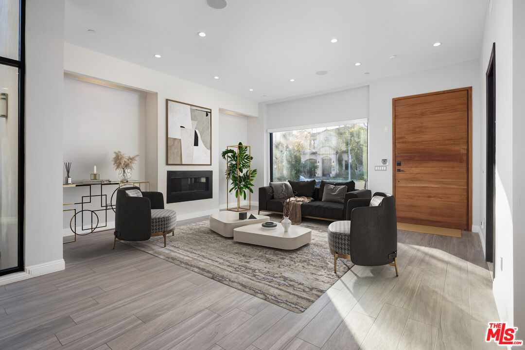 156 North Wetherly Drive Beverly Hills, CA 90211 - Photo 4 of 57 a living room with furniture kitchen and a wooden floor