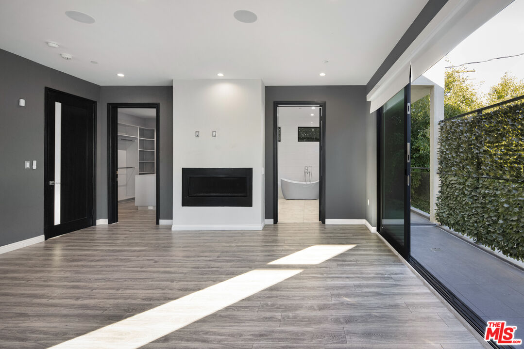 156 North Wetherly Drive Beverly Hills, CA 90211 - Photo 41 of 57 a view of a hallway with the wooden floor and staircase