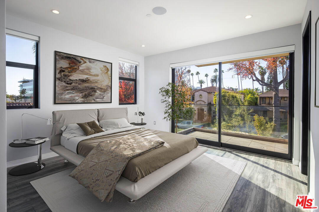 156 North Wetherly Drive Beverly Hills, CA 90211 - Photo 46 of 57 a bedroom with a large bed and a large window