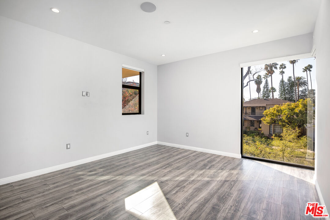 156 North Wetherly Drive Beverly Hills, CA 90211 - Photo 50 of 57 a view of empty room with wooden floor