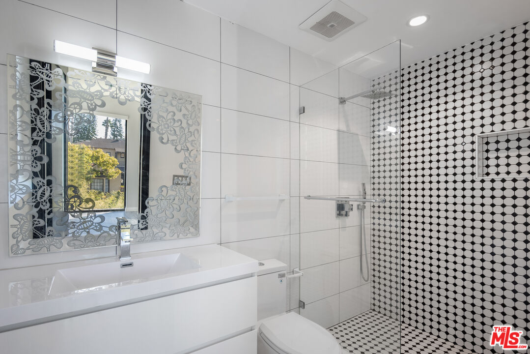 156 North Wetherly Drive Beverly Hills, CA 90211 - Photo 51 of 57 a bathroom with a sink toilet and shower