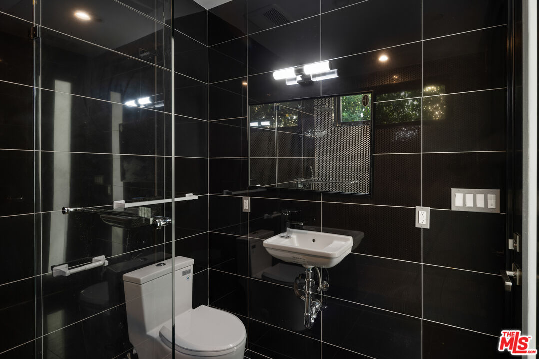 156 North Wetherly Drive Beverly Hills, CA 90211 - Photo 8 of 57 a bathroom with a toilet and a shower