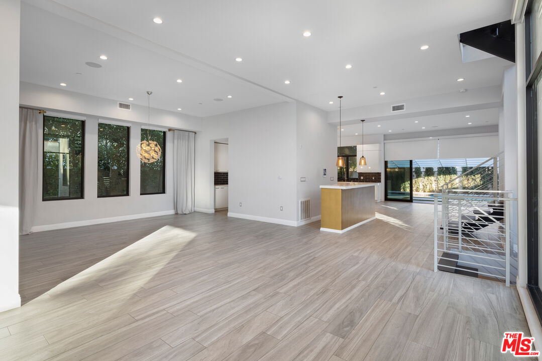 156 North Wetherly Drive Beverly Hills, CA 90211 - Photo 9 of 57 a view of kitchen with cabinets and wooden floor