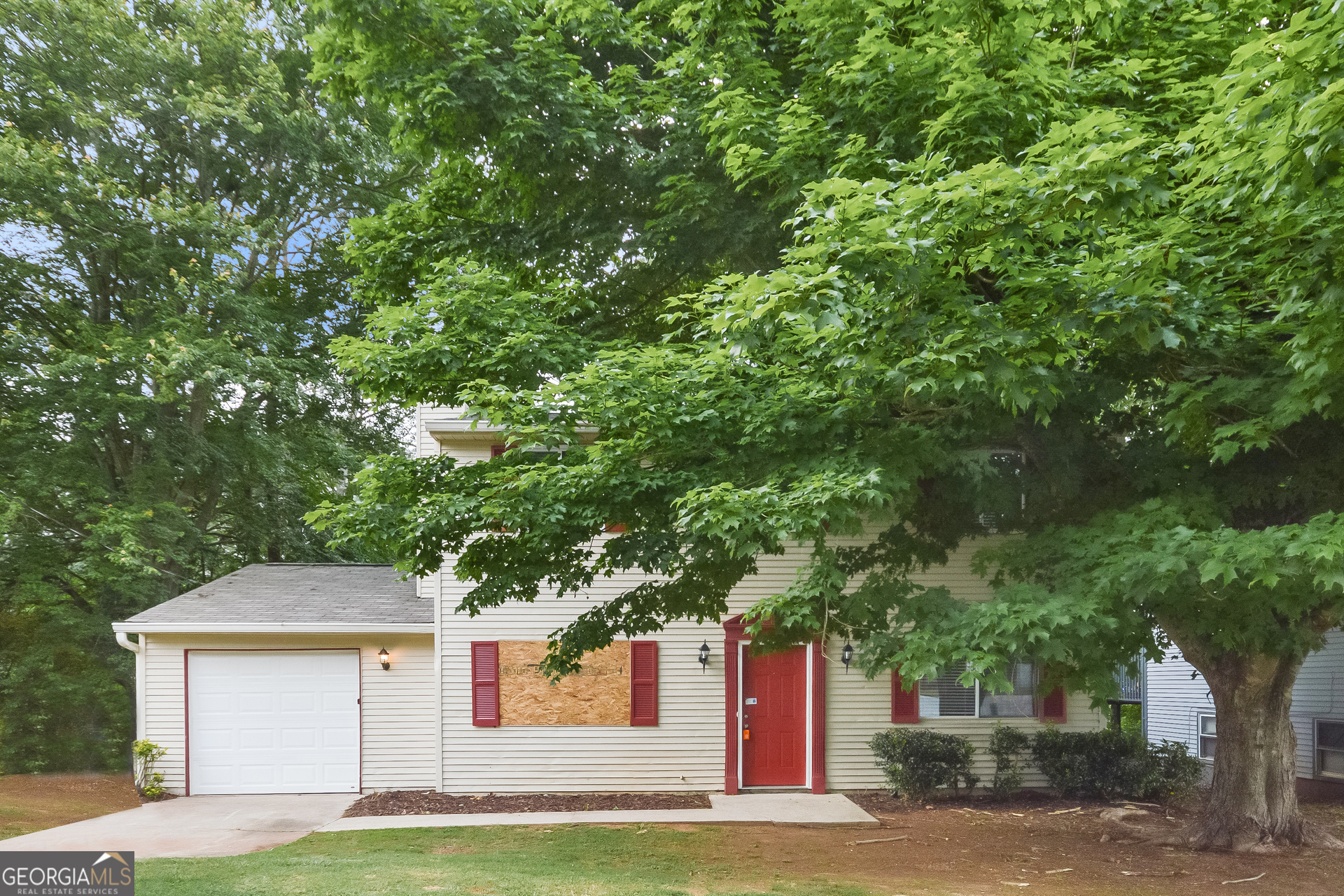 2193 Scarbrough Drive Stone Mountain, GA 30088 - Photo 1 of 17 a front view of a house with a garden
