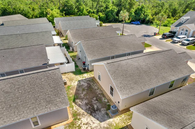an aerial view of a house with outdoor space